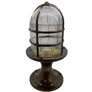Wellington Grand post light in solid antique brass and rated IP54, on white background.
