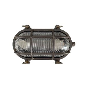 Small solid antique brass oval bulkhead light, rated IP64, shown horizontal on white background.
