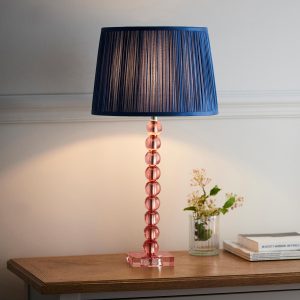 Adelie stacked blush crystal table lamp with blue silk shade on living room sideboard