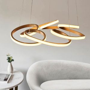 Dimmable satin gold finish modern multi spiral LED ceiling pendant, shown above a lounge sofa.