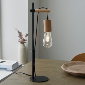 Sven natural wood table lamp in matt black finish on living room table
