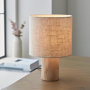 Durban natural wood table lamp with linen shade on living room table