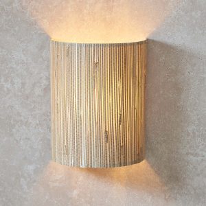 Longshaw curved wall washer light with natural seagrass shade, main image on room wall