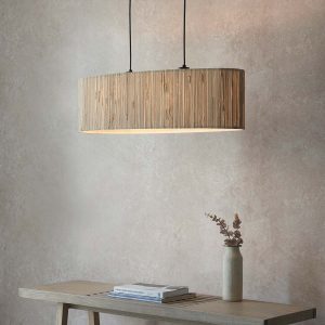 Longshaw 2 light oval pendant with natural seagrass shade, shown low over lounge table