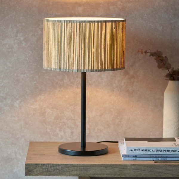 Longshaw single light table lamp with natural seagrass shade on living room table