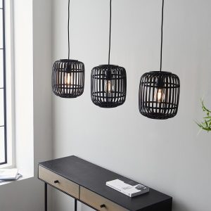 Mathias 3 light bar pendant with dark stained bamboo, showing shades over living room sideboard