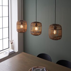 Mathias 3 light bar pendant with natural bamboo shades showing shades over dining table