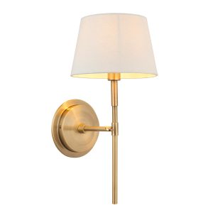 Rennes antique brass wall light with ivory shade on white background lit