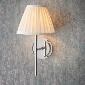 Rennes polished nickel wall light with cream pleated shade on wall, main image