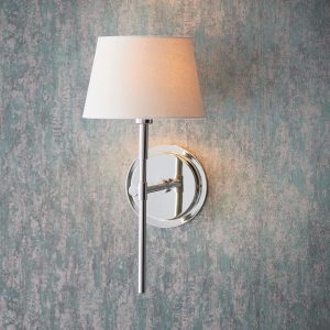 Rennes polished nickel wall light with ivory shade on lounge wall