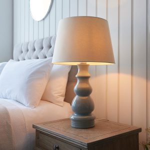 Provence grey ceramic table lamp with 40cm ivory shade on bedside table lit