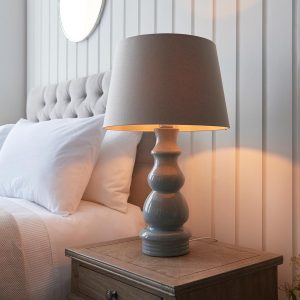 Provence grey ceramic table lamp with 40cm grey shade on bedside table lit