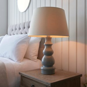 Provence grey ceramic table lamp with 45cm ivory shade on bedside table lit