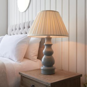 Provence grey ceramic table lamp with 46cm box pleat cream shade on bedside table lit