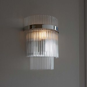 Marietta polished nickel wall light with clear glass rods on textured wall