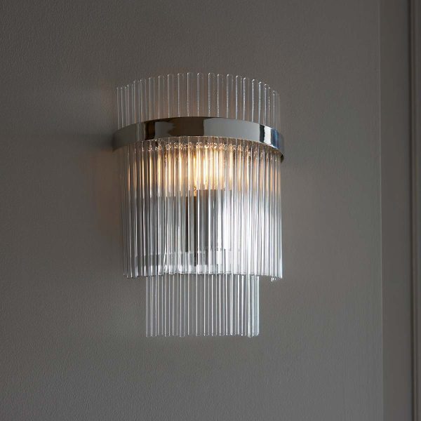 Marietta polished nickel wall light with clear glass rods on textured wall