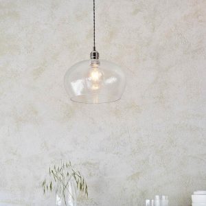 Timeless medium hammered glass kitchen pendant in polished nickel, shown over a sideboard.