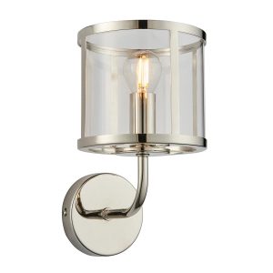 Hopton single wall light in polished nickel with clear glass shade on white background lit