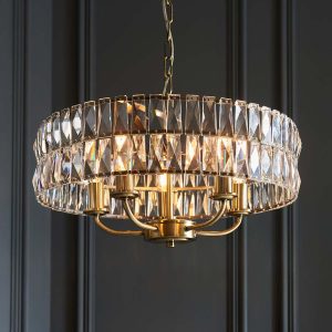 Clifton 5 light pendant in antique brass in grey panelled room