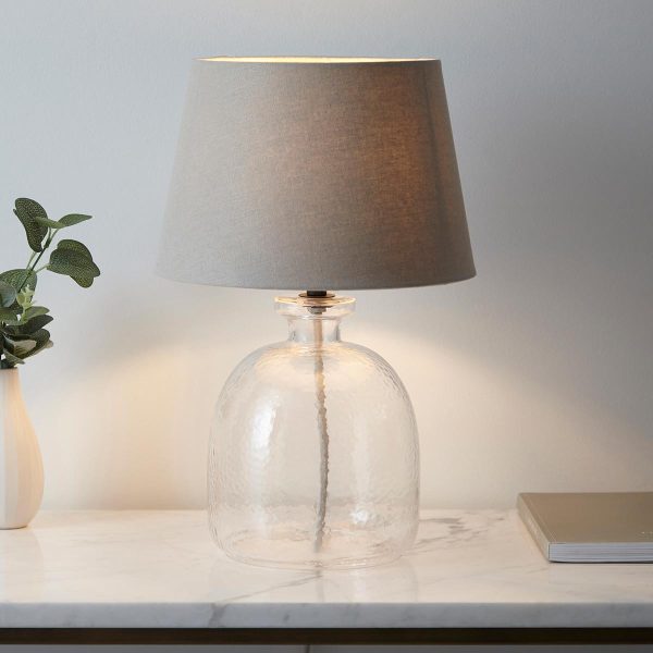 Lyra textured glass table lamp with grey shade, main image on sideboard