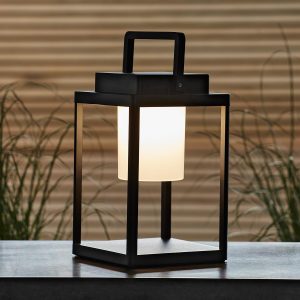 Voyage rechargeable outdoor table lantern in matt black in garden setting