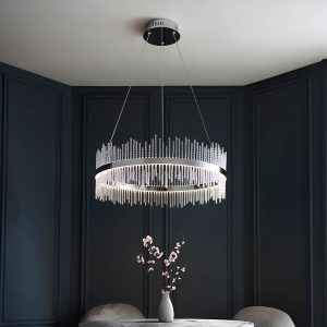 Dimmable polished chrome ring LED pendant with twisted glass rods, shown hanging over a dining room table.