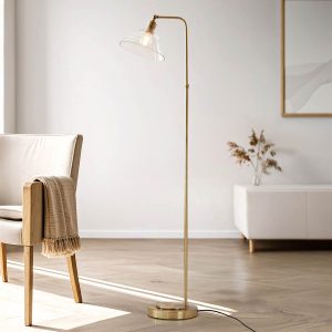 Classic antique brass floor lamp with clear glass shade, shown in sitting area.