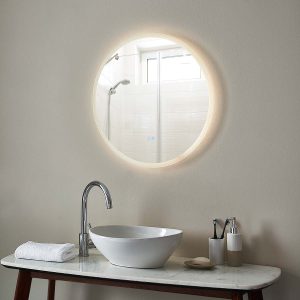 Eclipse round CCT LED bathroom mirror with demister pad above basin lit