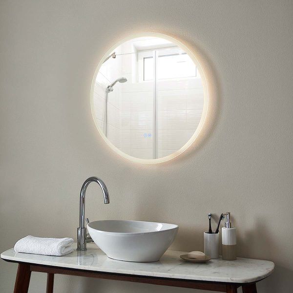 Eclipse round CCT LED bathroom mirror with demister pad above basin lit
