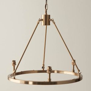 Aged brass 3 light hoop design chandelier fitting only, on taupe background.