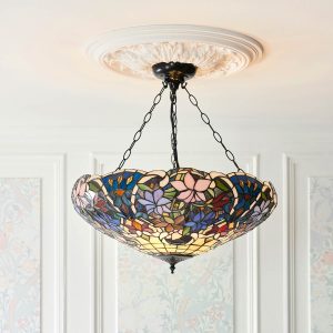 Sullivan large inverted Tiffany pendant with floral design, shown on room ceiling.
