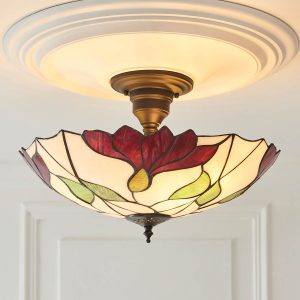 Botanica large Tiffany semi flush ceiling light with floral design, shown in panelled room.