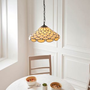 Pearl Tiffany single light pendant with geometric style, shown over dining room table.