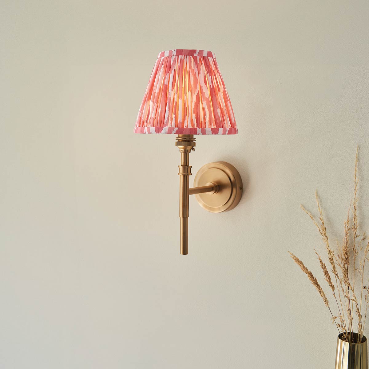 Single Aged Brass Wall Light with Coral Pink Ikat Shade
