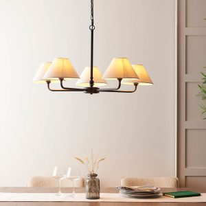 Lille classic 5 light chandelier in matt black with natural faux linen shades, shown over a dining room table.
