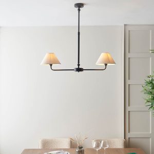 Lille classic 2 light linear pendant in matt black with natural faux linen shades, shown over dining room table.