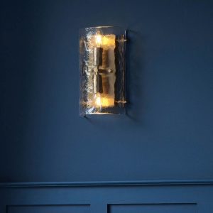 Keller 2 light wall light in aged brass with textured handmade glass, viewed straight on.