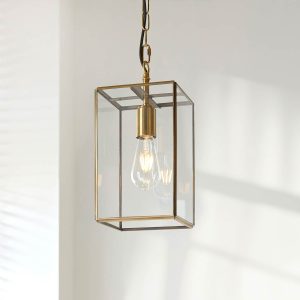 Hammond small hanging box lantern in antique brass with clear glass panels, shown on ceiling.