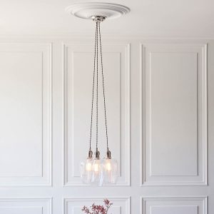 3 light cluster pendant in polished nickel with clear glass goblet shades, shown in panelled room.