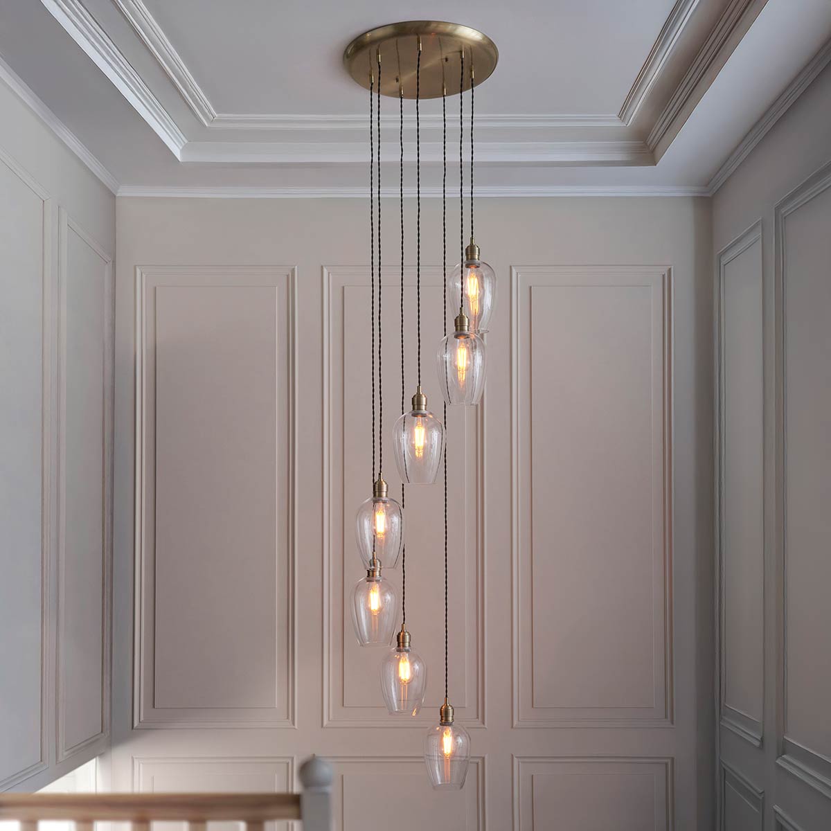 7 Light Stairwell Pendant in Antique Brass with Clear Glass