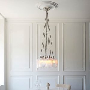 7 light cluster pendant in polished nickel with ribbed glass goblet shades, full height over a dining room table.