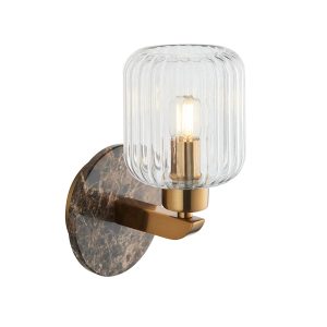Travi single wall light in aged brass with solid brown marble wall plate and ribbed glass shade.