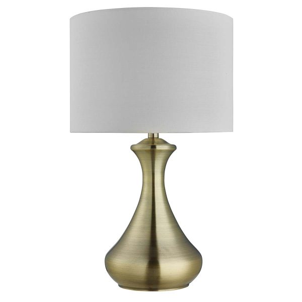 Touch bedside table lamp in antique brass with cream shade on white background