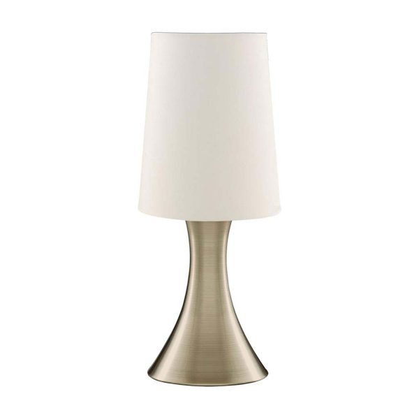 Touch table lamp in antique brass with white cylinder shade on white background