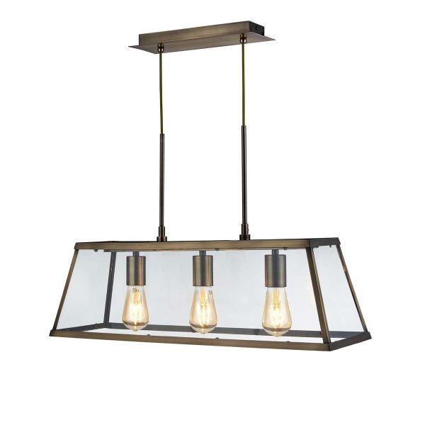 Voyager industrial 3 light pendant lantern in antique brass on white background lit