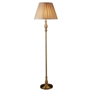 Flemish floor lamp standard in antique brass with pleated mink shade on white background lit