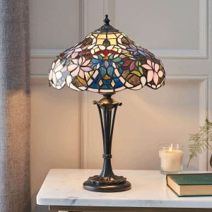 Sullivan floral Tiffany table lamp on lounge table lit