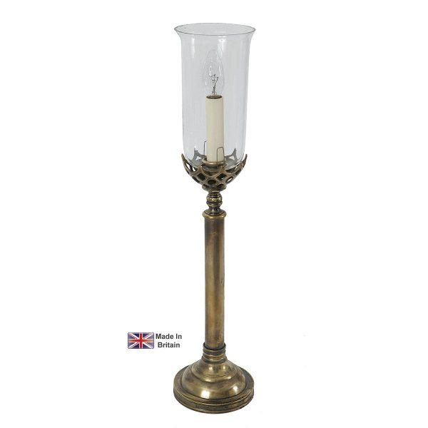 Gothic medium 1 light table lamp in solid brass with storm glass shade shown in light antique