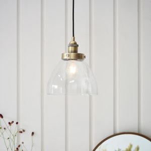 Hansen 1 light small ceiling pendant in antique brass shown in panelled room