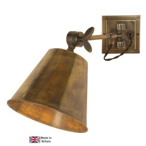 Library vintage style swing arm wall light in solid brass shown in light antique
